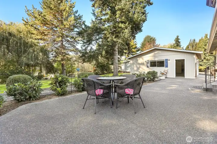 Front of home with a patio and bordering a community greenbelt, trail and creek on both the west and south sides