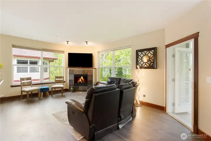 Warm inviting fireplace living space with views.