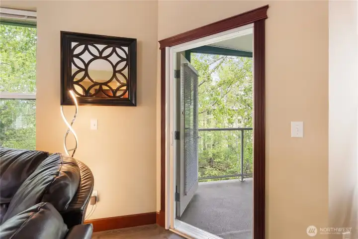Patio screen door allows for fresh air and listening to the birds in the trees.