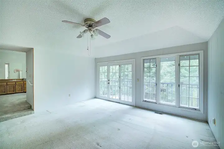primary bedroom with French doors to deck