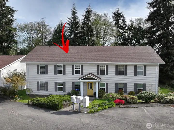 Upper level unit. Enter via shared access (yellow door in photo) and up the stairs and to the left to enter.  There is an intercom system for guests to buzz you for access.