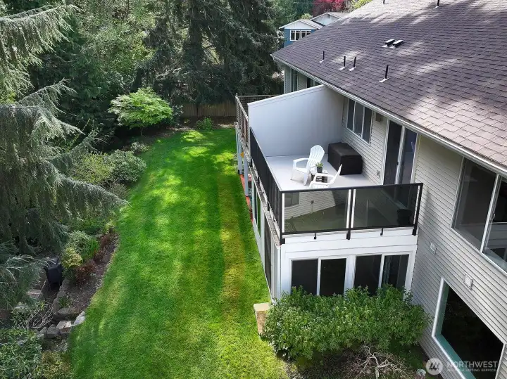 This unit is tucked alongside a creek with cedars and firs close by.