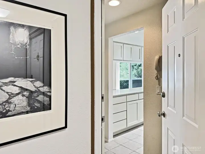 Welcome to your sweet Langley condo. The phone visible in the photo is connected to the intercom at the main entrace so you can buzz visitors into the main building. Ceramic tile entry & kitchen.