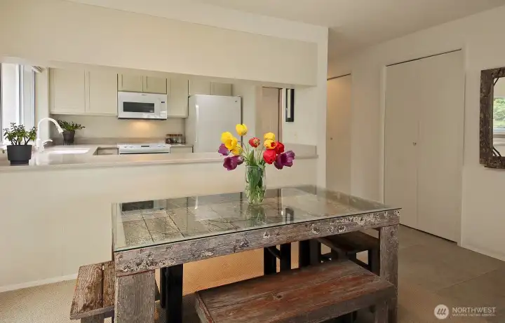 The two closets at the entry are visible in this photo. One (closer to the entry door) is a pantry space w/shelving, the other (to the right) is a coat closet & home to the electric hot water heater (replaced a few years ago).