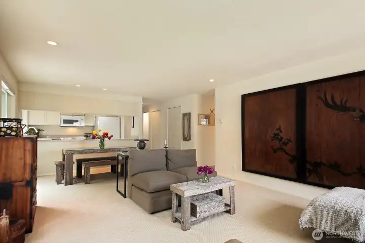 Hallway to both bedrooms, bathrooms & Laundry closet is visible to the left of wood panel art. Let's go check out the bedrooms & bathrooms.
