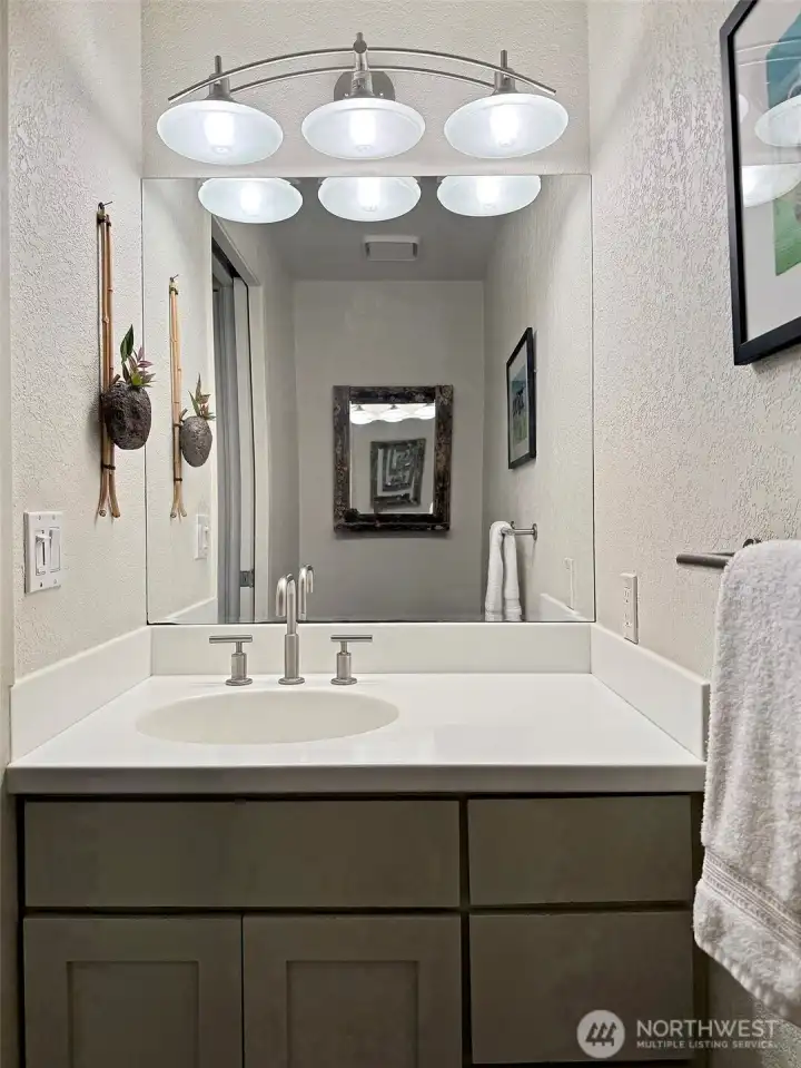 Half bath, located in the hallway to the left of Bedroom #2.