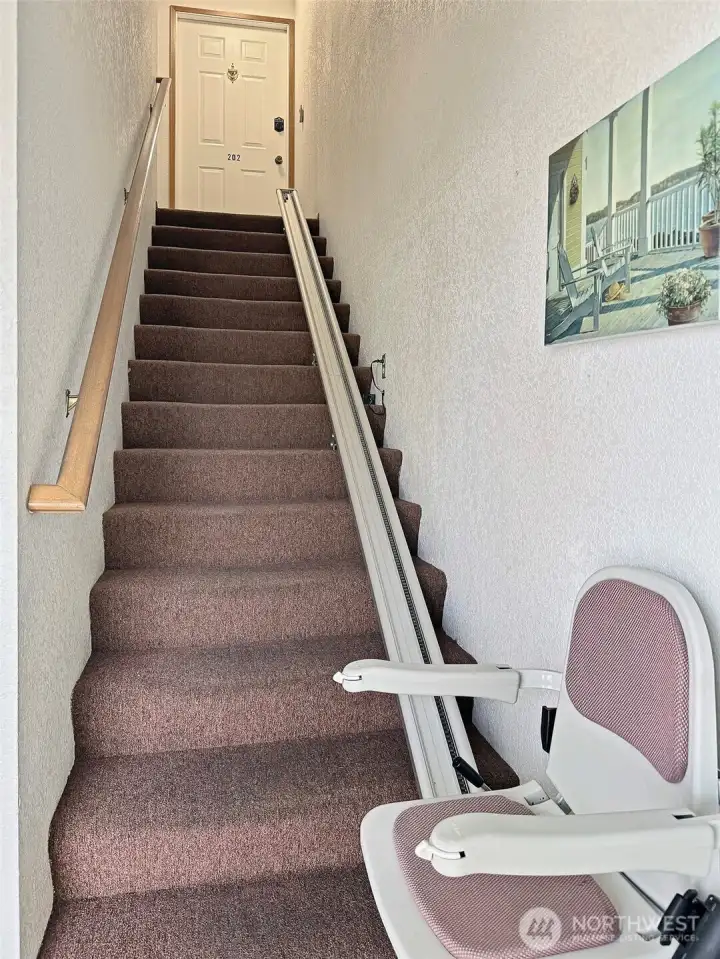 Chair lift is available for the two upper units. Entrance to Unit 202 is at the top of the stairs to the left. The storage closet in the hall belongs to Unit 201.