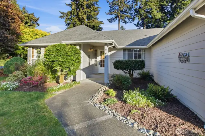Lovely front entry and landscaped yard... the home boasts all cement planked lap siding in excellent condition!
