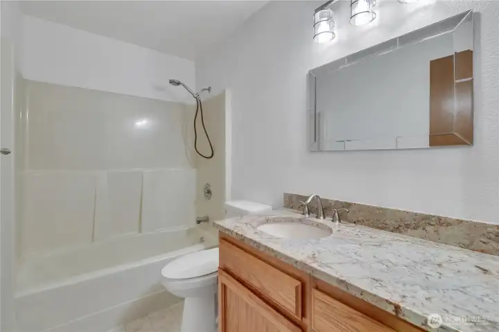 Remodeled main bath as well, also with quality granite counters, drop-in china sink and new faucet!