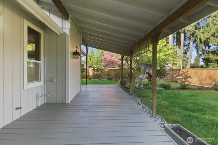 Yes, this is a lovely, very large back covered deck for your enjoyment.