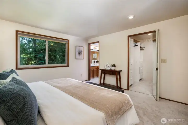 Primary has walk-in closet w/ organizer & private bath