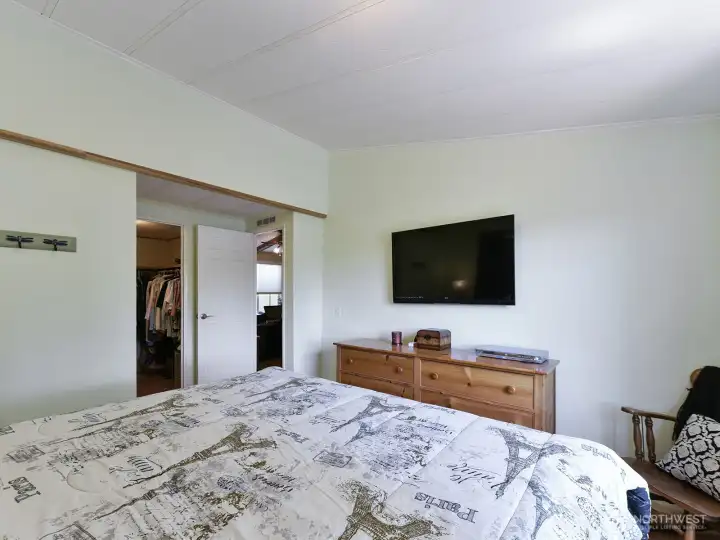 The light and bright primary ensuite is located at the end of the home with a 3/4 bath and walk-in closet.  Lots of natural light from 2 newer windows and high ceilings.