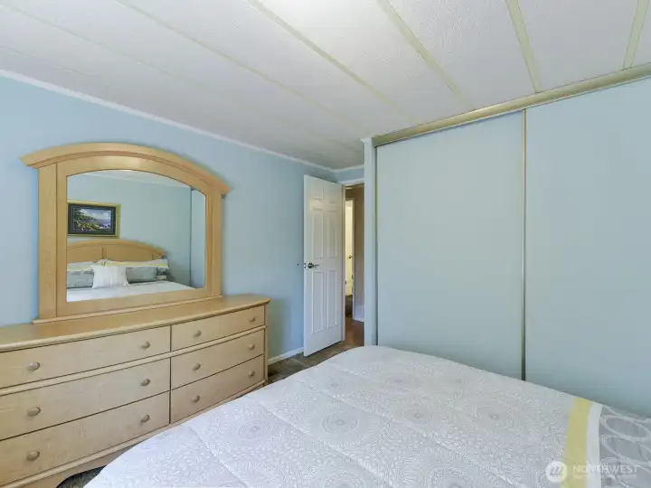 With the split design of this home, the 2 guest bedrooms are located at the opposite end of the home from the primary ensuite, yet convenient to the hall full bathroom.