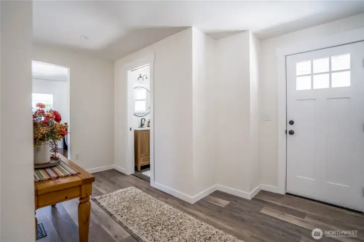 Side door that leads to garage. 1/2 Bath in Hallway