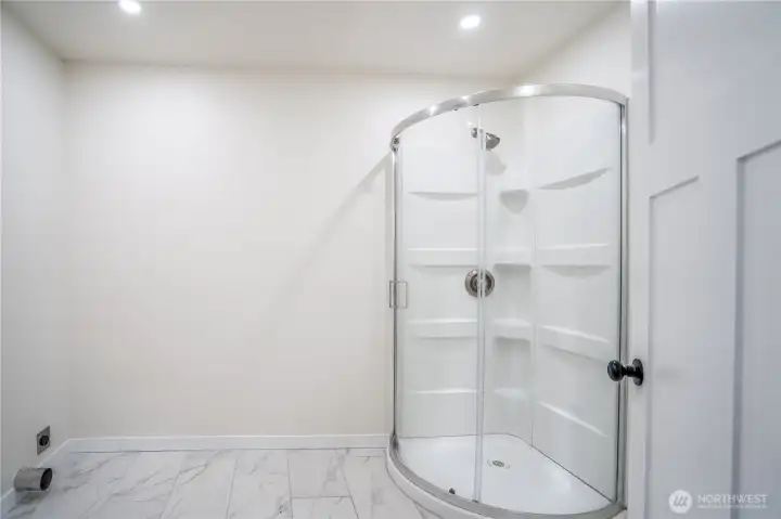 Main floor laundry room with 3/4 Bath