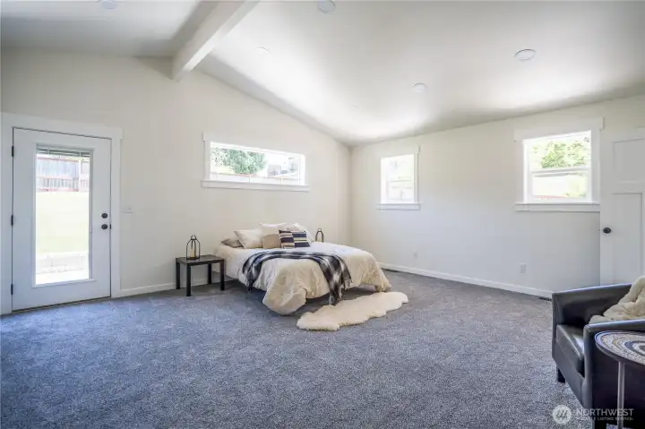 Primary Bedroom has it's own door out to the back deck/yard