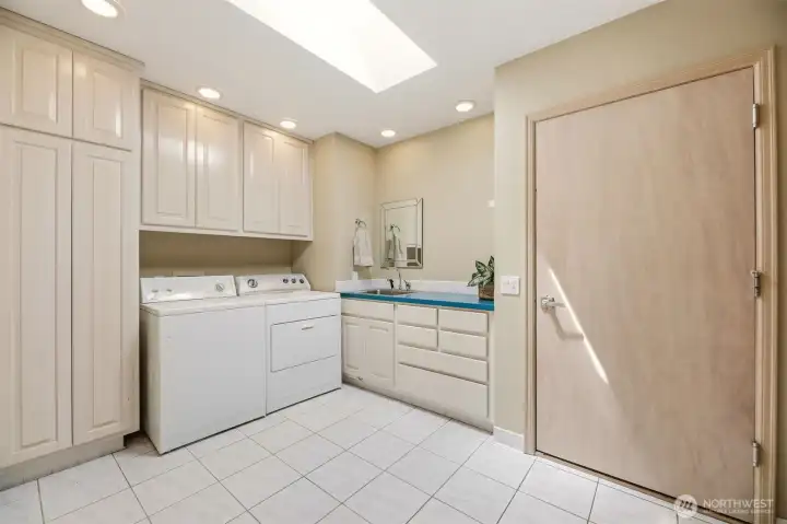 Utility Room with lots of storage and even built in ironing board.