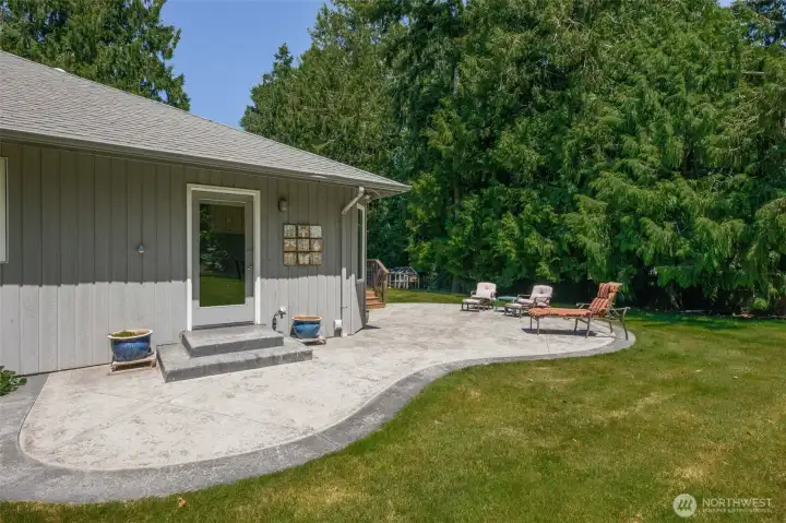 Stamped Concrete Pad wraps around from the Kitchen to the back deck