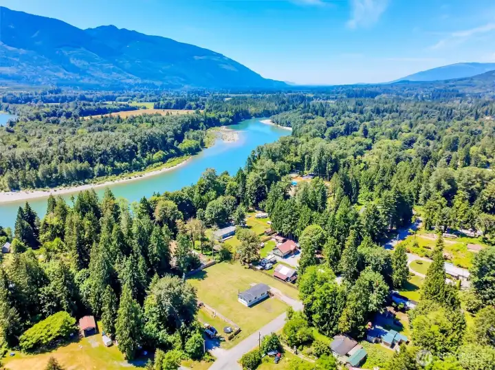 a Community private Park with playground, covered barbeque area and beautiful sandy beach you can see on the right center of this photo. The double lot and home can be seen in the center foreground of this photo.