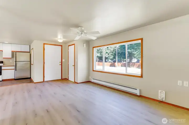 Another view from the living room looking back toward the main entry door and the coat closet on the right.