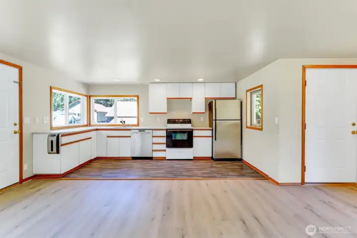 Full kitchen view with door to back porch on the left.