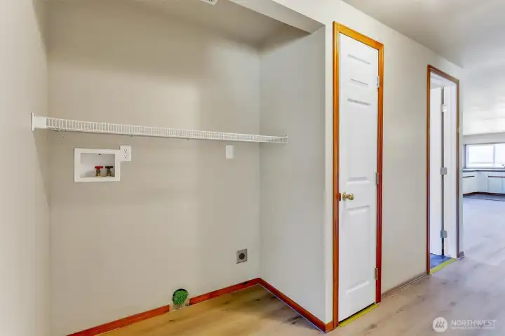 Laundry area in the hallway outside the bedrooms.