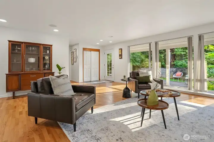 Floor to ceiling windows flood the living room with light all day long. Floor to ceiling windows flood the living room with light all day long.