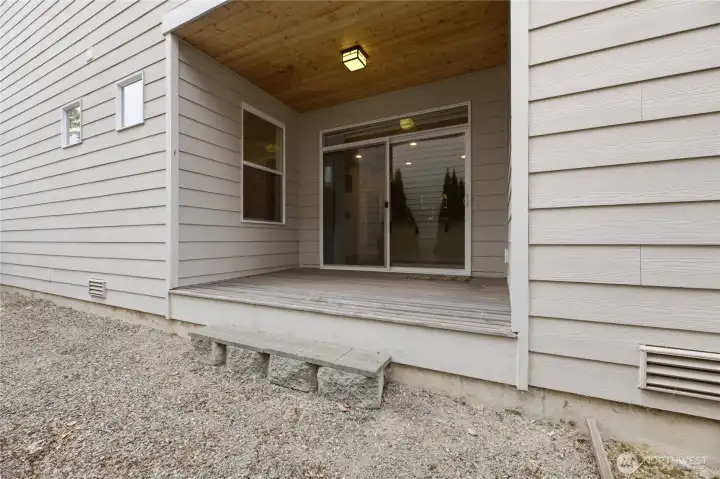 Side yard featuring a private porch.