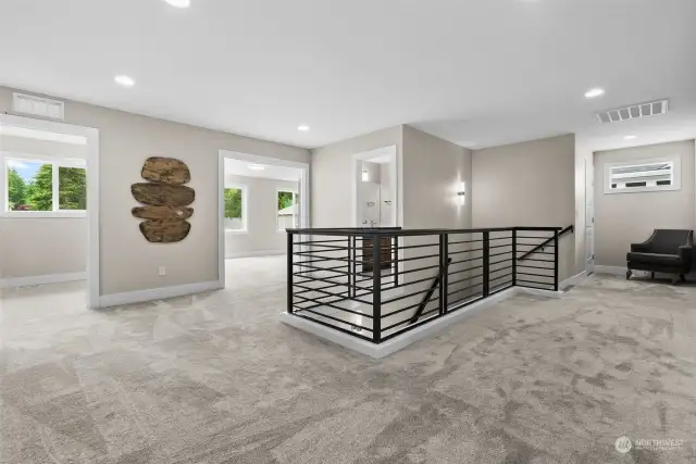 Wander upstairs with the modern metal railing and feel the cozy carpet underfoot.  The installation of 6 pound padding ensures a plush carpet.