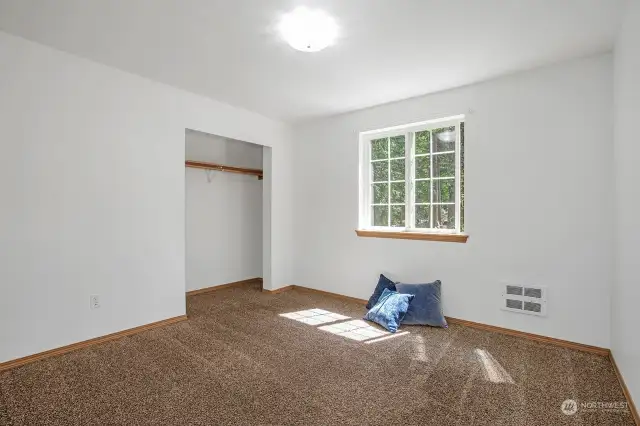 Nice-sized second bedroom is light and bright. Closet doors on site.