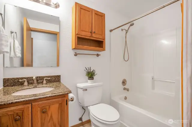 Full upstairs hall bath featuring all the amenities with a touch of class.