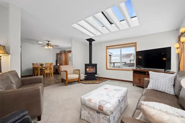 Living Space is kept warm with a new propane freestanding stove while being bright with natural light from the skylight.