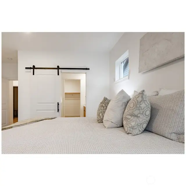 Sliding barn door to the primary en-suite.