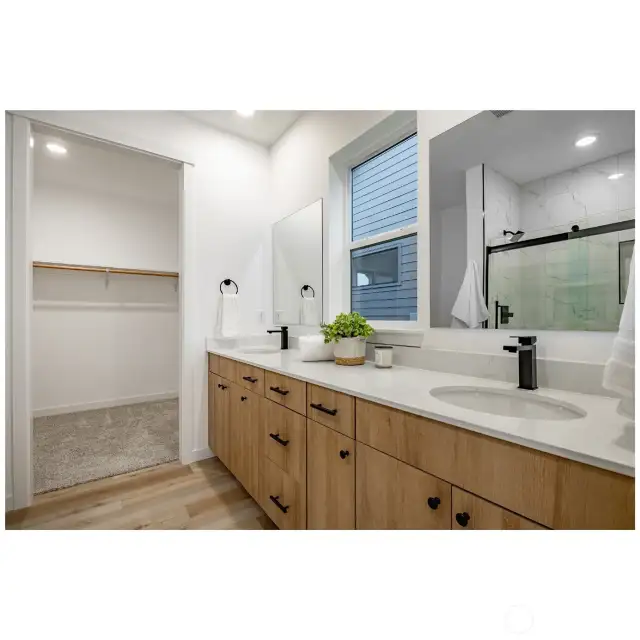 Dual primary vanity sinks.
