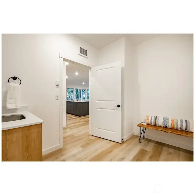 Laundry with room for bench seating.