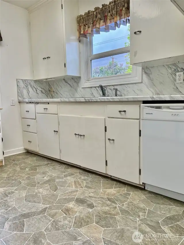 The kitchen offers a great deal of cabinetry, beautiful counter tops.  It is an efficient & wonderful space for sure