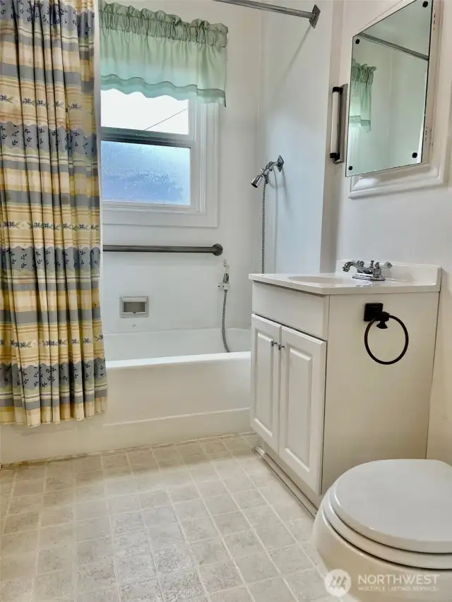 The full bathroom is between the two bedrooms and is light and bright with a window for a wonderful air flow.
