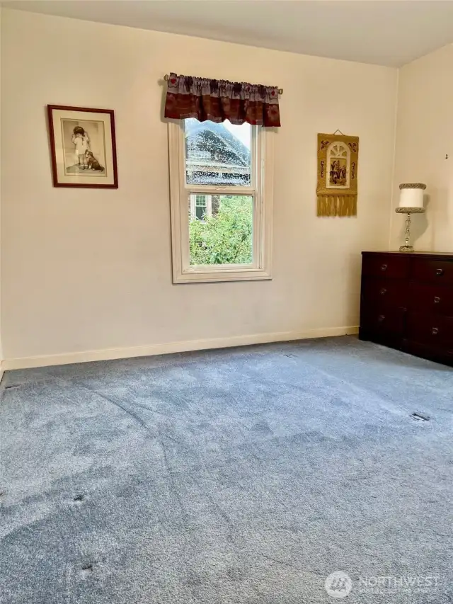 This view of Bedroom 2 of 2 shows one of the two large windows that this bedroom offers