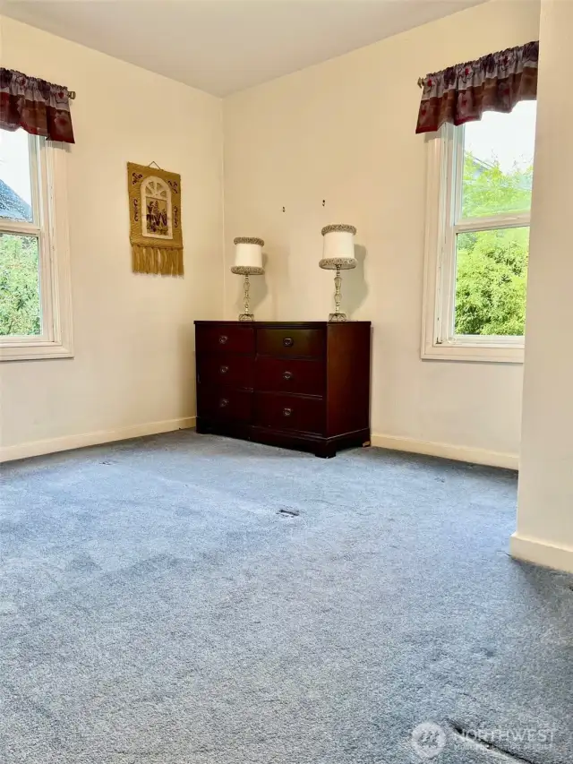 Bedroom 2 of 2 is light and airy with the two beautiful windows that make the room a delightful space