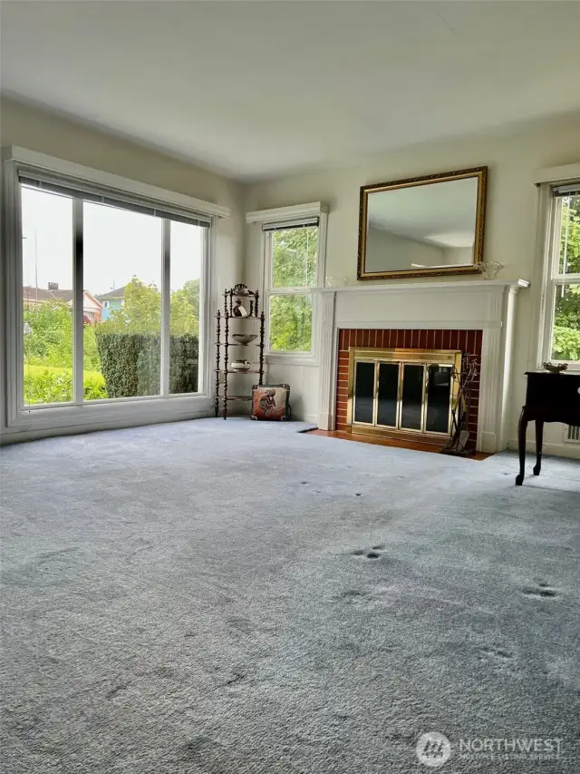 View of the living room with a wood burning fireplace to make sure you have warm and cozy nights.