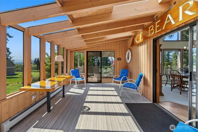 Large sunroom with slider out to the large entertainment deck!