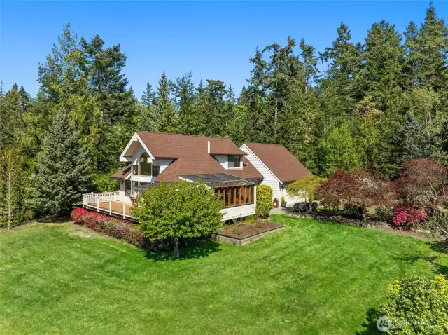 Custom built with gorgeous landscaping!