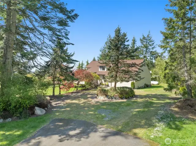 Located at the end of the street and features a circular driveway!