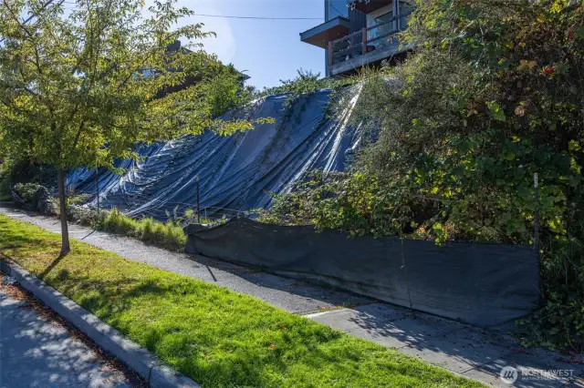 And the embankment that a retaining wall and steps will be required for this lot and the neighboring home to the north (the sellers’ home).  We already have plans and (almost) a permit.  The goal here is to build the wall for both the existing home to the north, and the vacant lot at the same time.  (North neighbor to pay for their wall).