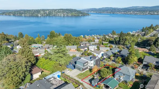 Looking down on the lot while facing NE.  New house on the north side of the lot is the Sellers’ home.