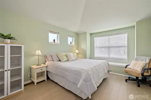 Spacious primary bedroom with window seating/storage.   .
