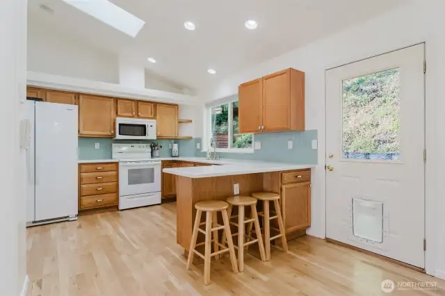 Eating bar counter here with barstools. Skylight on the main level.