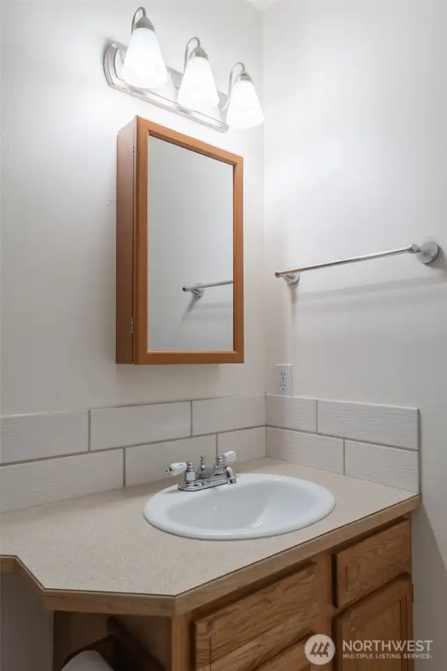 Third full bath downstairs.