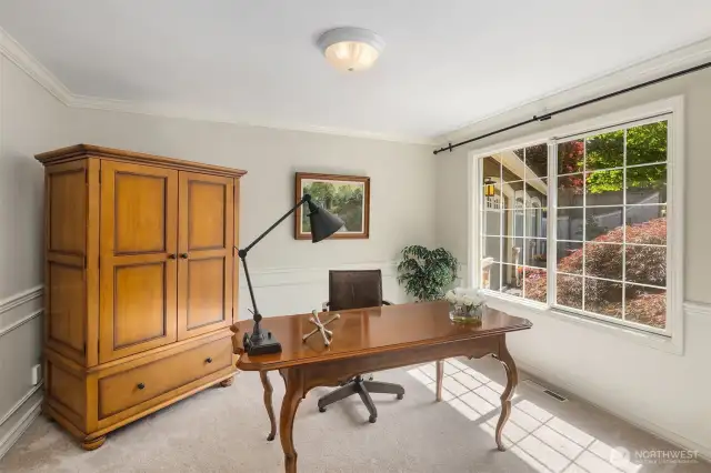 Main floor den, filled with light - a wonderful place to work from home.