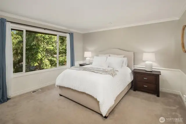 Large primary suite, very private with a forested backdrop and two walk in closets